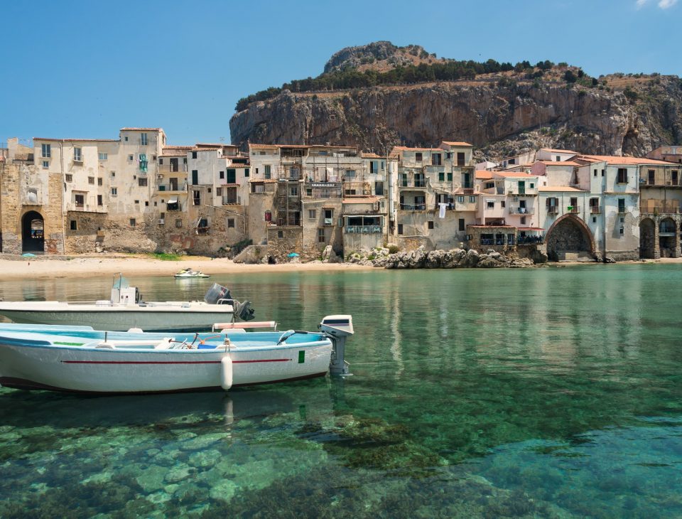 Boats and clear water in Cefalu town